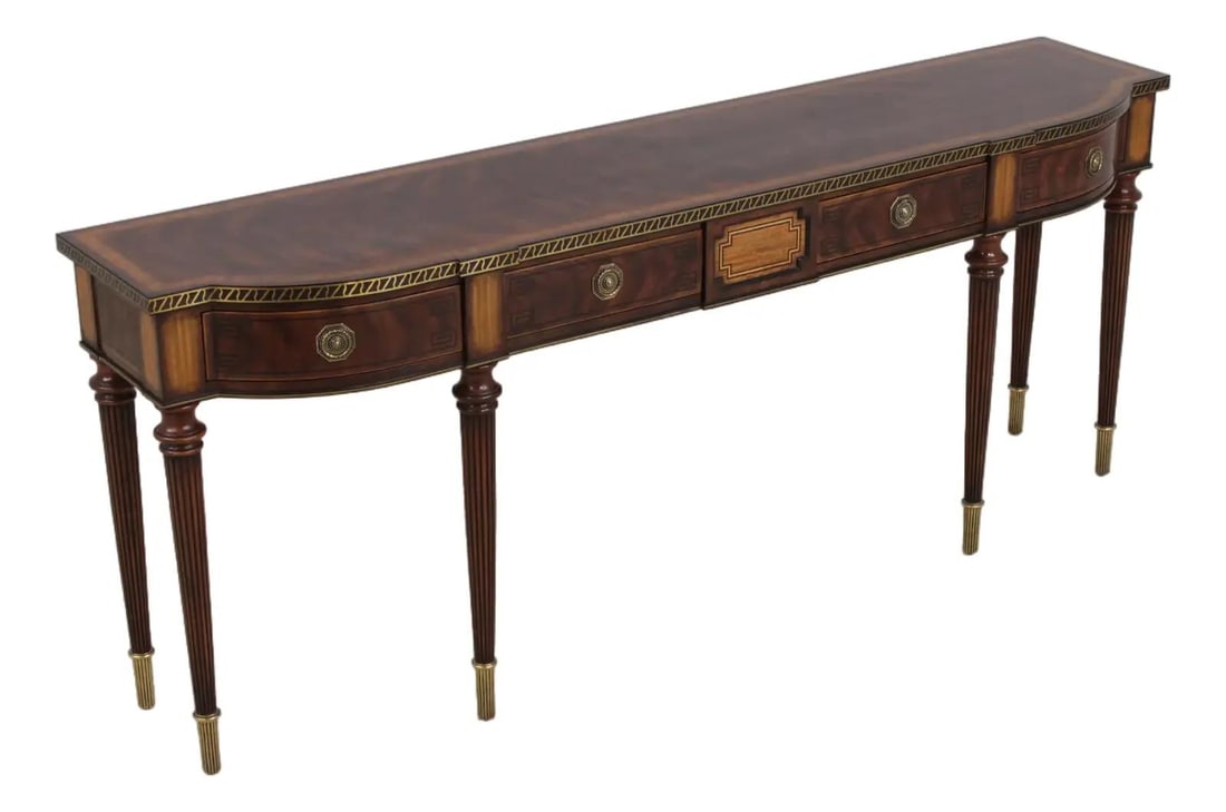 Mahogany Buffet Table with Inlay and Brass Accents Georgian Inspired: Mahogany Buffet Table with Inlay and Brass Accents Georgian Inspired This Georgian style buffet console table features mahogany construction with satin wood inlay details and fluted legs. The piece in