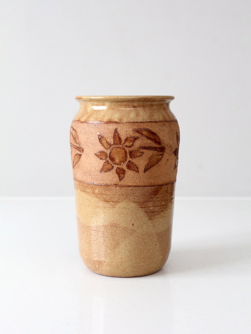 Signed Brown Glazed Studio Pottery Floral Carved Vase 8.75 inch: Signed Brown Glazed Studio Pottery Floral Carved Vase 8.75 inch This vintage studio pottery vase showcases a beautiful rich brown glaze complemented by a carved floral motif that encircles its center.