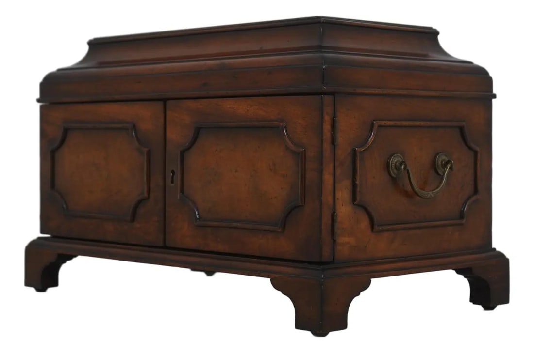 Mahogany Storage Chest With Asian Motif Chess Set and Brass Accents: Mahogany Storage Chest With Asian Motif Chess Set and Brass Accents This storage box from the 1980s features finely carved, Asian-inspired chess pieces and is constructed from factory distressed mahog