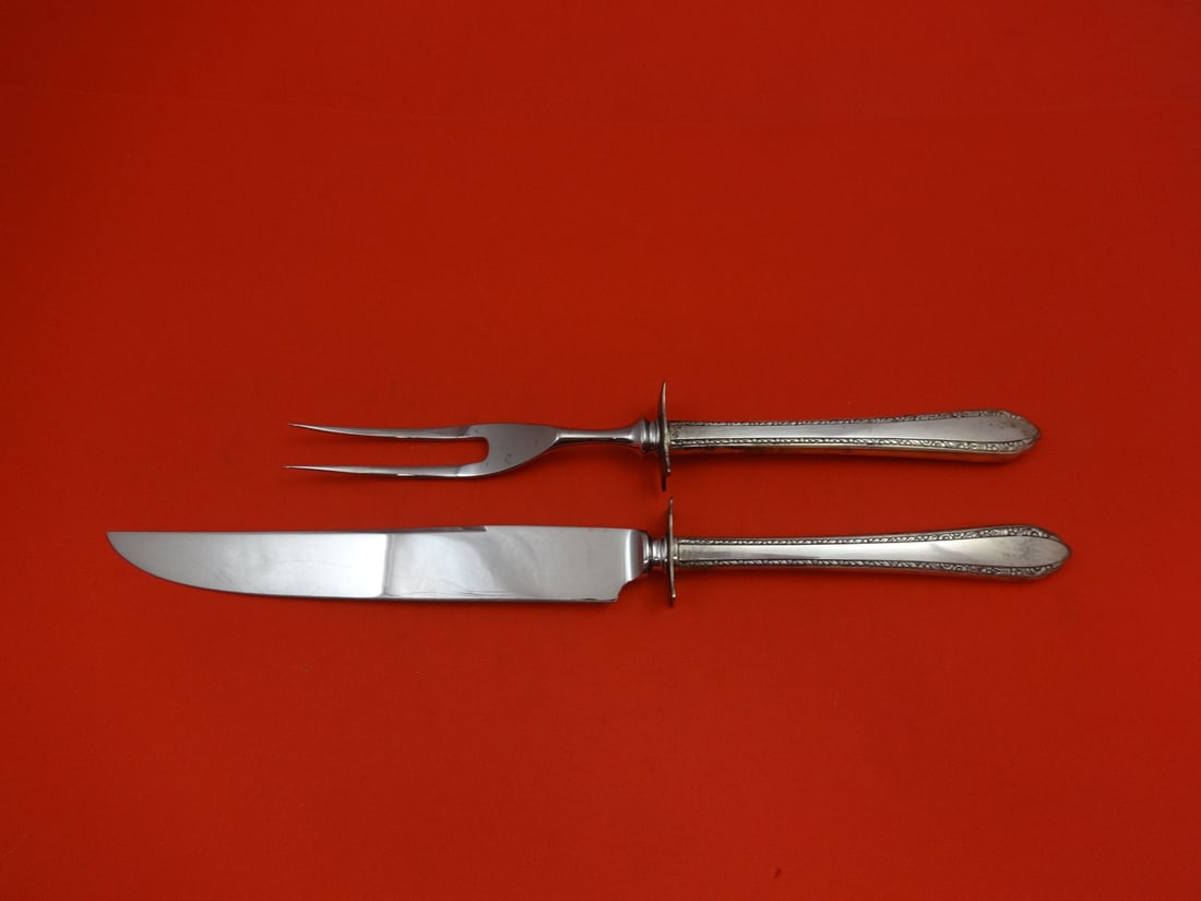 Royal Crest Wildflower Sterling Silver Carving Set 2pc 11.5": Royal Crest Wildflower Sterling Silver Carving Set 2pc 11.5" This exquisite 2-piece steak carving set features a stunning wildflower pattern and is crafted from high-quality sterling silver. Made by R