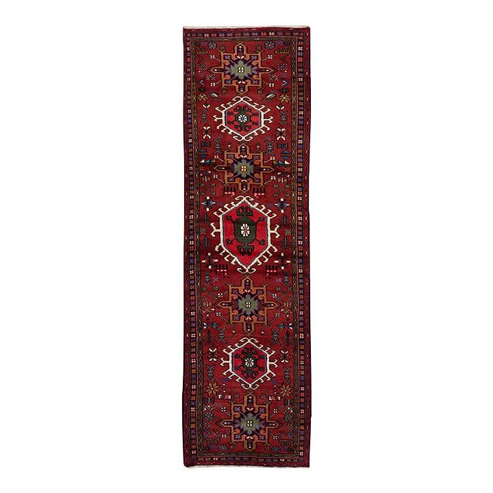1980s Persian Heriz Handmade Red Wool Runner 2'9" x 10': 1980s Persian Heriz Handmade Red Wool Runner 2'9" x 10' Discover this exquisite vintage Persian Heriz handmade wool runner featuring a stunning red color field adorned with multicolor accents in an in