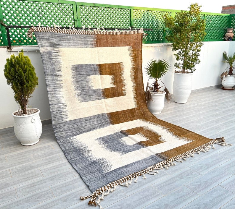 Authentic Handmade Moroccan Berber Wool Rug 9.84 x 6.56 feet: Authentic Handmade Moroccan Berber Wool Rug 9.84 x 6.56 feet Discover the charm of a Beautiful Authentic Handmade Moroccan Berber Wool Rug. This exquisite piece is meticulously handwoven in the Atlas 