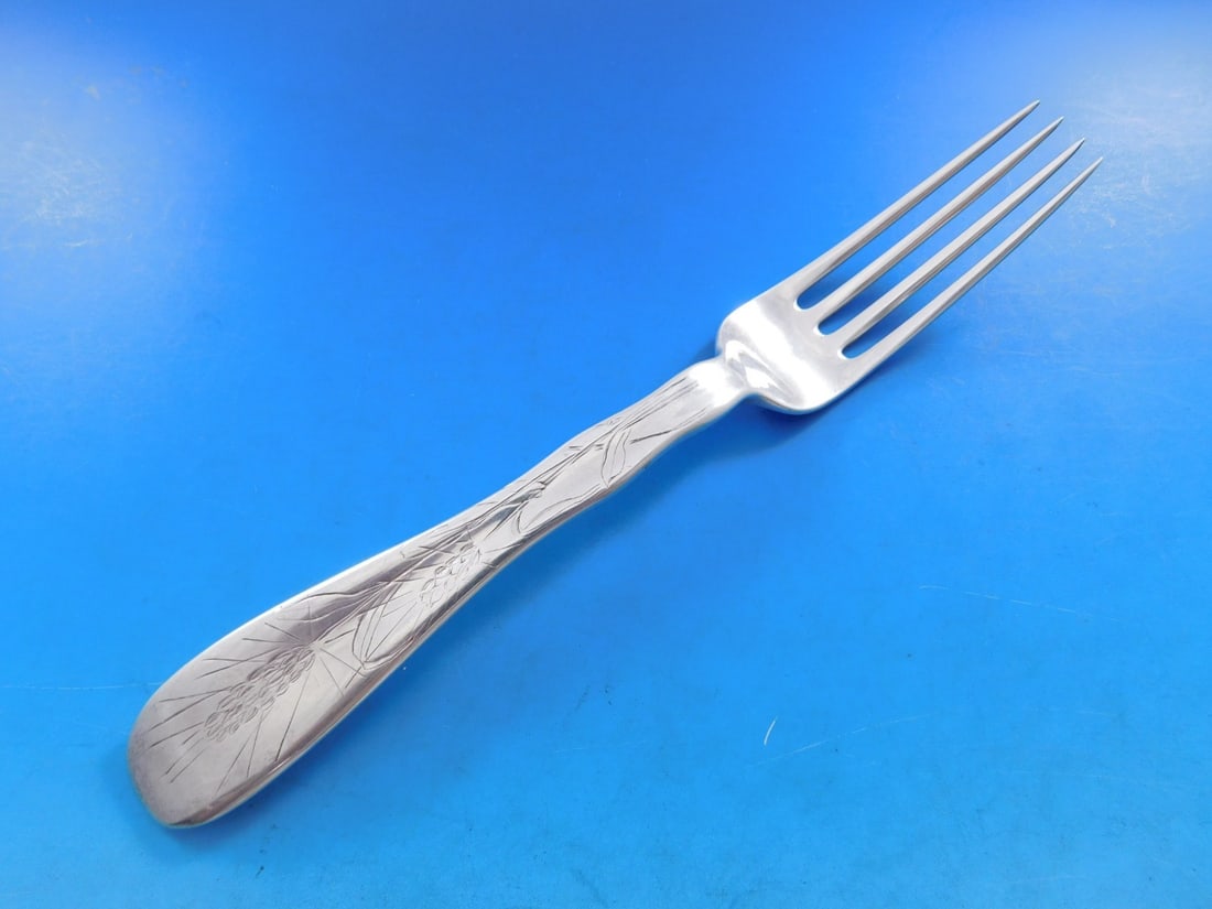 Tiffany Sterling Silver Lap Over Acid Etched Dinner Fork 7 7/8 Wheat Motif: Tiffany Sterling Silver Lap Over Acid Etched Dinner Fork 7 7/8 Wheat Motif This exquisite sterling silver dinner fork features the elegant Lap Over Edge pattern by Tiffany & Co., crafted between 1850-