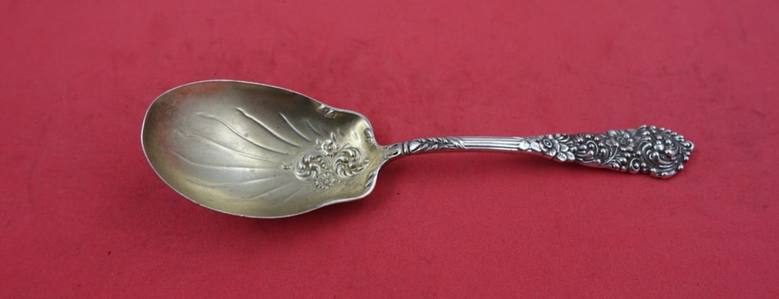 Reed & Barton Trajan Sterling Silver Preserve Spoon Gold-Washed 6 1/8": Reed & Barton Trajan Sterling Silver Preserve Spoon Gold-Washed 6 1/8" Experience the elegance of the Trajan pattern with this exquisite preserve spoon crafted by Reed and Barton. This serving spoon, 