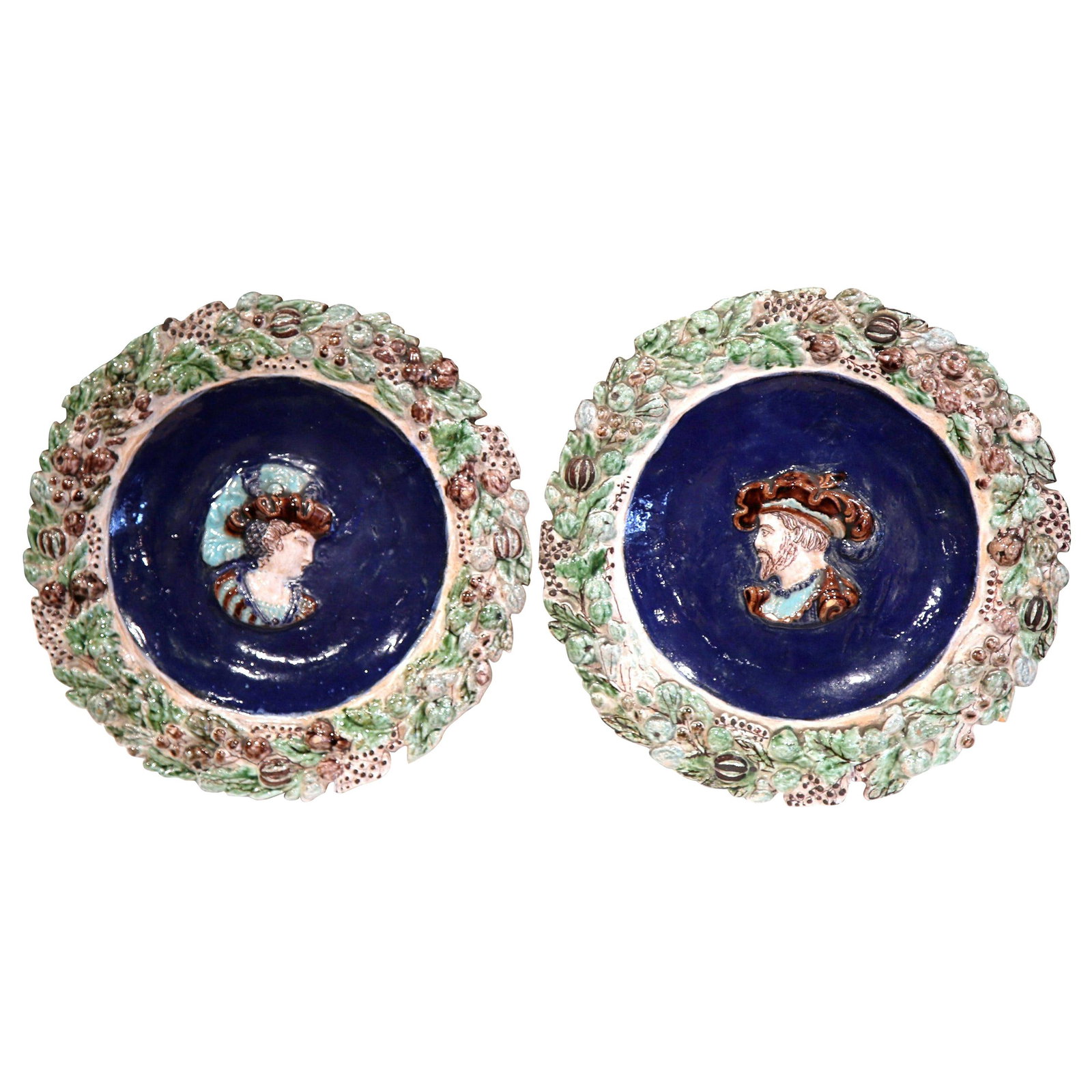 19th Century French Renaissance Majolica Portrait Plates Set of 2: 19th Century French Renaissance Majolica Portrait Plates Set of 2 This exquisite pair of 19th Century French Renaissance majolica portrait plates, crafted circa 1850, showcases vibrant craftsmanship p