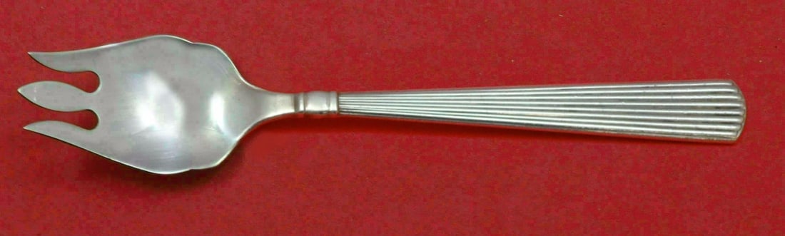 Reed and Barton Ashmont Sterling Silver Cake Ice Cream Spork 5 3/4": Reed and Barton Ashmont Sterling Silver Cake Ice Cream Spork 5 3/4" This exquisite spork from the Ashmont pattern by Reed and Barton is a versatile utensil perfect for serving cake and ice cream. Craf