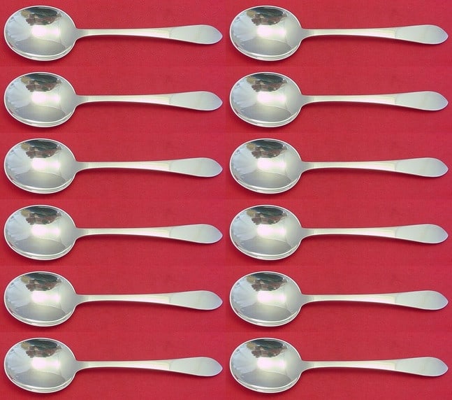 Tiffany & Co. Faneuil Sterling Silver Cream Soup Spoons Set of 12: Tiffany & Co. Faneuil Sterling Silver Cream Soup Spoons Set of 12 Indulge in the elegance of the Faneuil pattern by Tiffany & Co. This exquisite set includes 12 cream soup spoons, each measuring 6 3/4