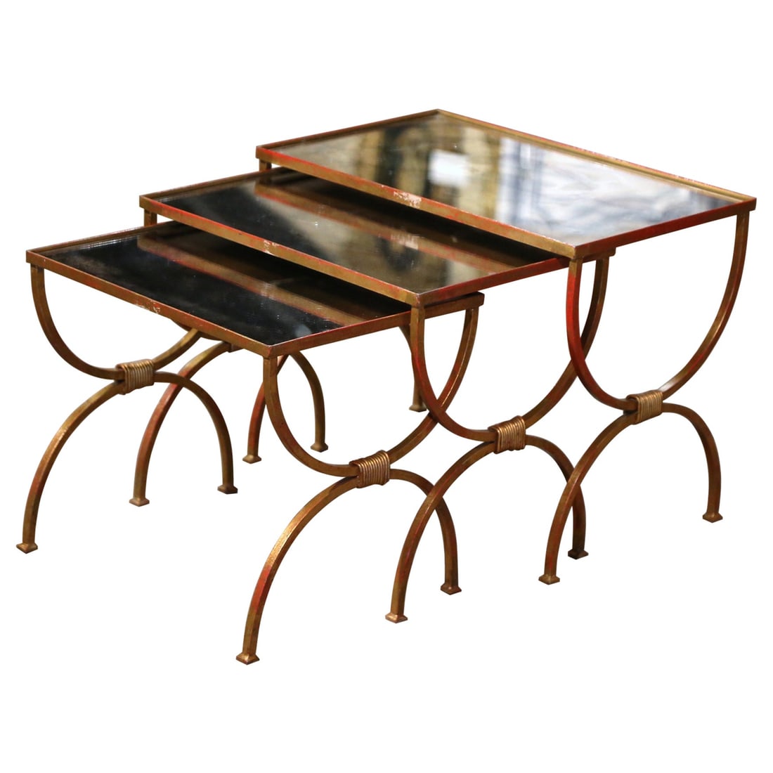 French gilt iron verre eglomise nesting tables set of 3: French gilt iron verre eglomise nesting tables set of 3 This set of three mid-century French nesting tables showcases elegant craftsmanship with hand-forged gilt iron frames and original mirrored verr