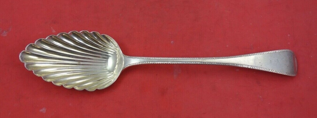 Georgian Sterling Silver Berry Spoon London 1826 WM Eley 8 3/4": Georgian Sterling Silver Berry Spoon London 1826 WM Eley 8 3/4" This exquisite English Georgian sterling silver berry spoon, crafted in London in 1826, features a beautifully scalloped bowl designed b
