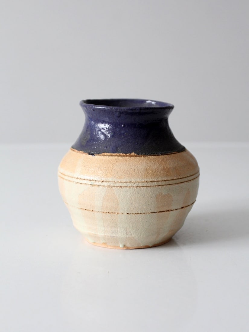 Indigo Glazed Studio Pottery Vase Handmade Vintage 5 Inch: Indigo Glazed Studio Pottery Vase Handmade Vintage 5 Inch This vintage studio pottery vase features a striking contrast of textures and tones, showcasing a deep indigo glazed rim that flows into a nat