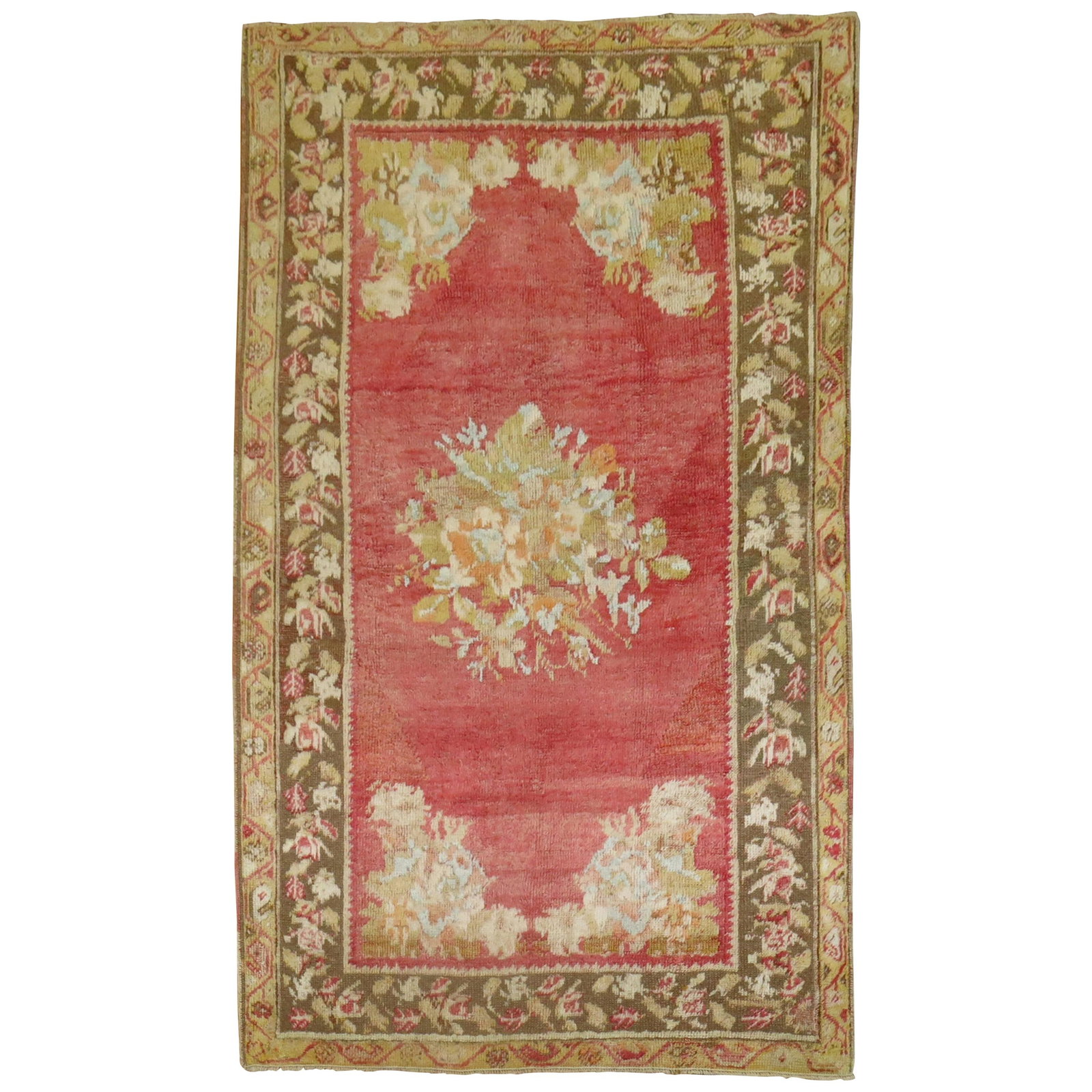 Antique Turkish Ghiordes Wool Floral Medallion Rug: Antique Turkish Ghiordes Wool Floral Medallion Rug This antique Turkish Ghiordes rug, dating to circa 1920, features a romantic style with a soft-colored floral open medallion design and a floral bord