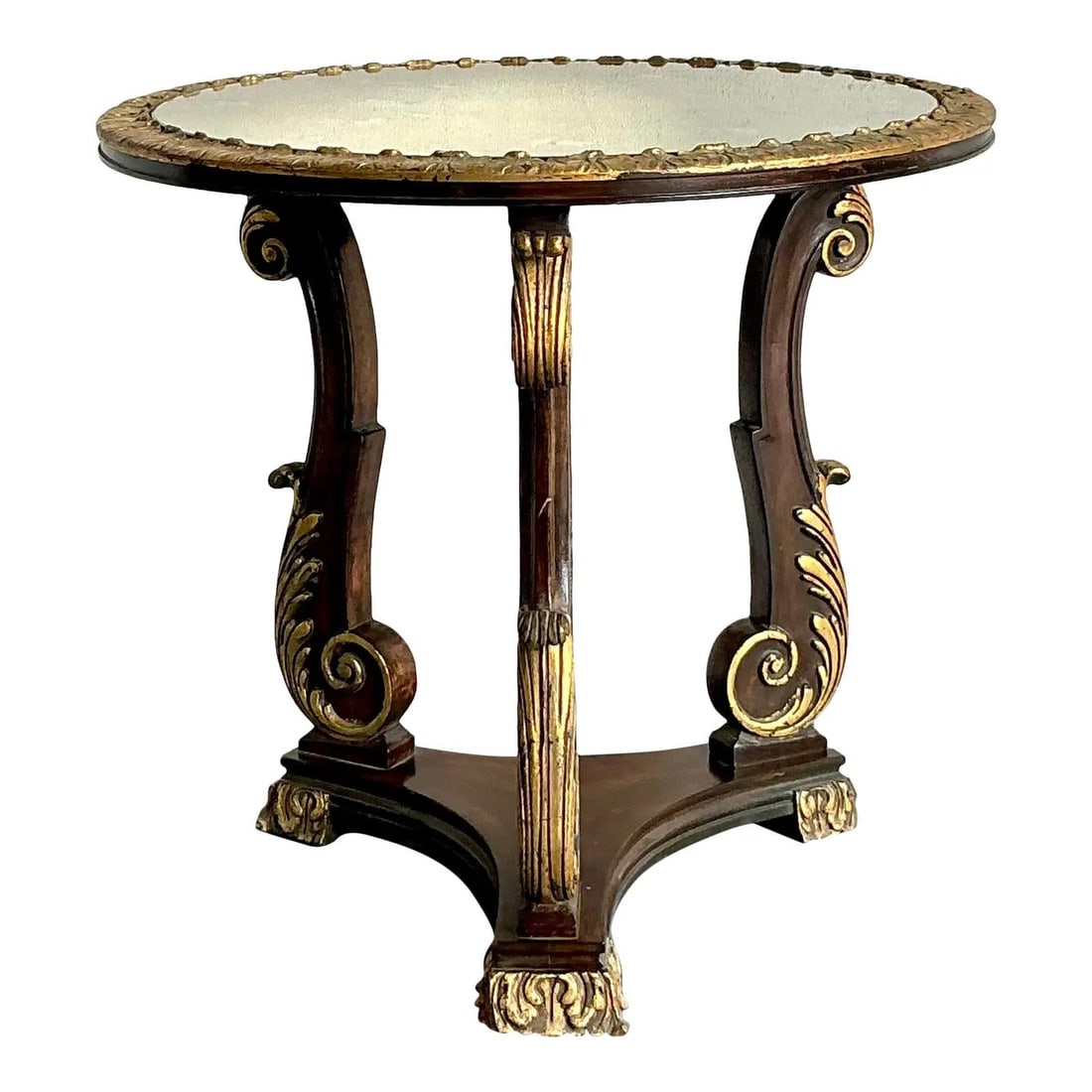 Baroque Revival Mirrored Pedestal Table with Gilt Cabriole Legs and Acanthus Detailing: Baroque Revival Mirrored Pedestal Table with Gilt Cabriole Legs and Acanthus Detailing This vintage Regency side table features a round mirrored top and a richly carved, gilded apron for a sophisticat