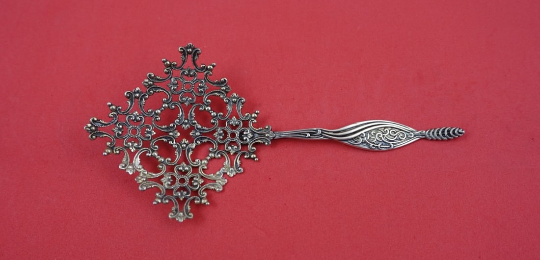 Sterling Silver Nut Spoon with Pierced Middle Eastern Motif 5.5 Inch: Sterling Silver Nut Spoon with Pierced Middle Eastern Motif 5.5 Inch This sterling silver nut spoon by Shiebler features a pierced design with a Middle Eastern motif. Measuring 5 1/2 inches in length,