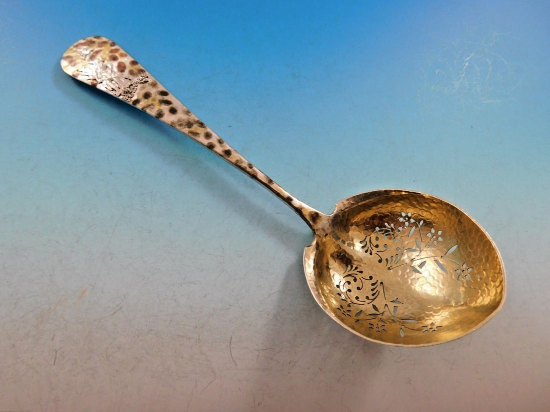 Gorham Cairo Sterling Silver 8" Sugar Sifter with Man Bird Design: Gorham Cairo Sterling Silver 8" Sugar Sifter with Man Bird Design This exquisite 8" sugar sifter, crafted by Gorham in the Cairo pattern, showcases a captivating design with a mix of gilded metals. Th