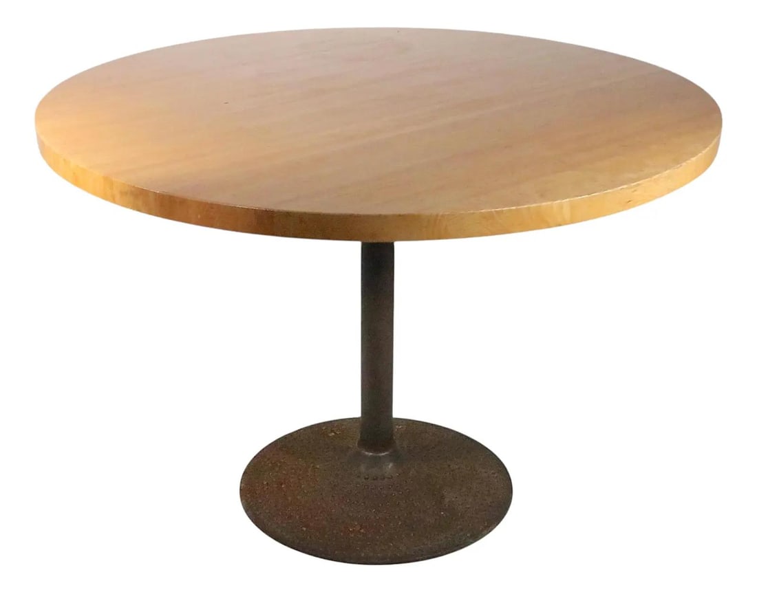 Mid Century Round Bistro Dining Table Oak Top Cast Iron Base 42": Mid Century Round Bistro Dining Table Oak Top Cast Iron Base 42" This Mid Century Round Cafe Style Bistro Dining Table combines functionality with a timeless design. Crafted from a solid oak top and s