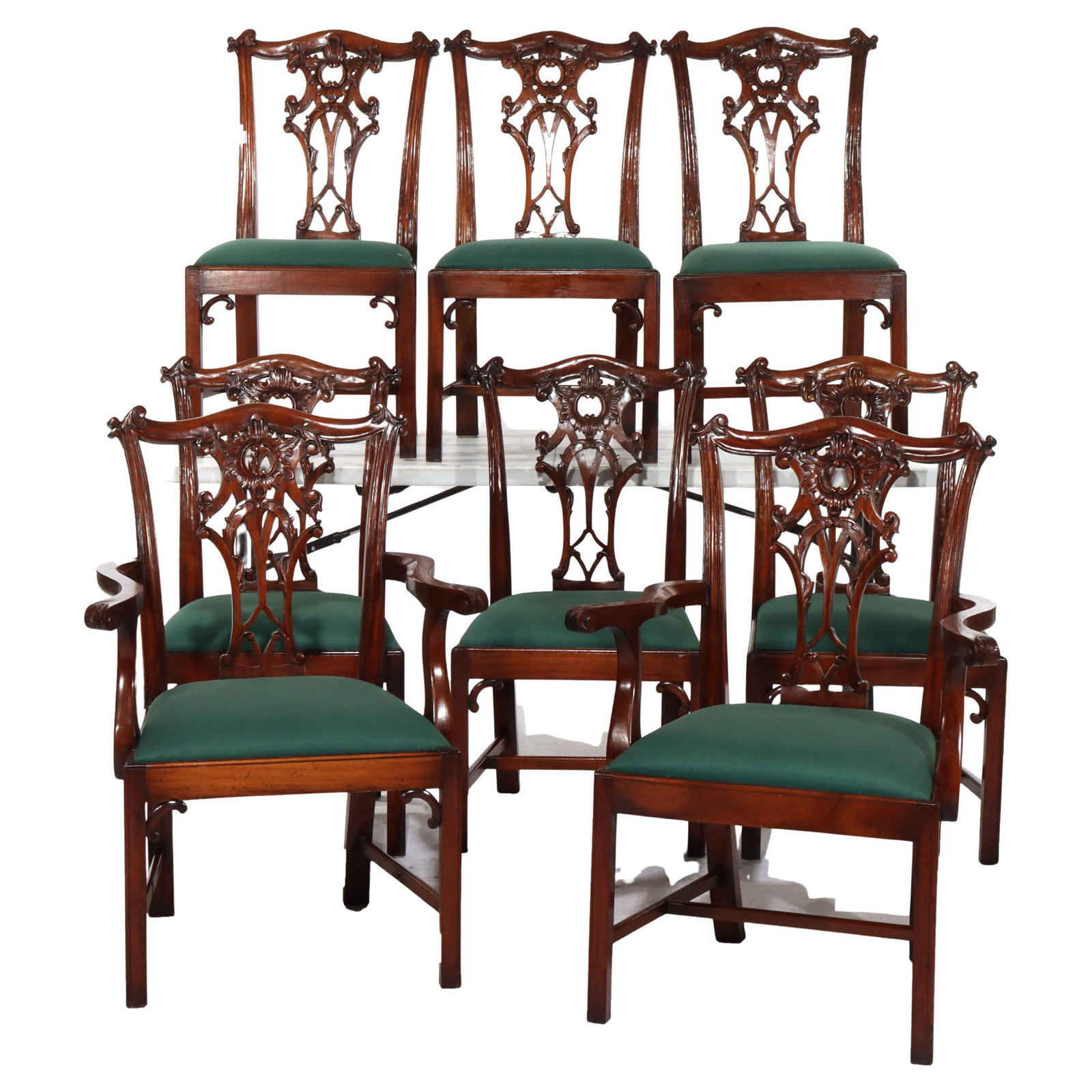 Set of 8 Antique Chippendale Carved Mahogany Dining Chairs: Set of 8 Antique Chippendale Carved Mahogany Dining Chairs This exquisite set of eight antique Chippendale dining chairs, crafted circa 1920, showcases the timeless elegance of the Chippendale style. 