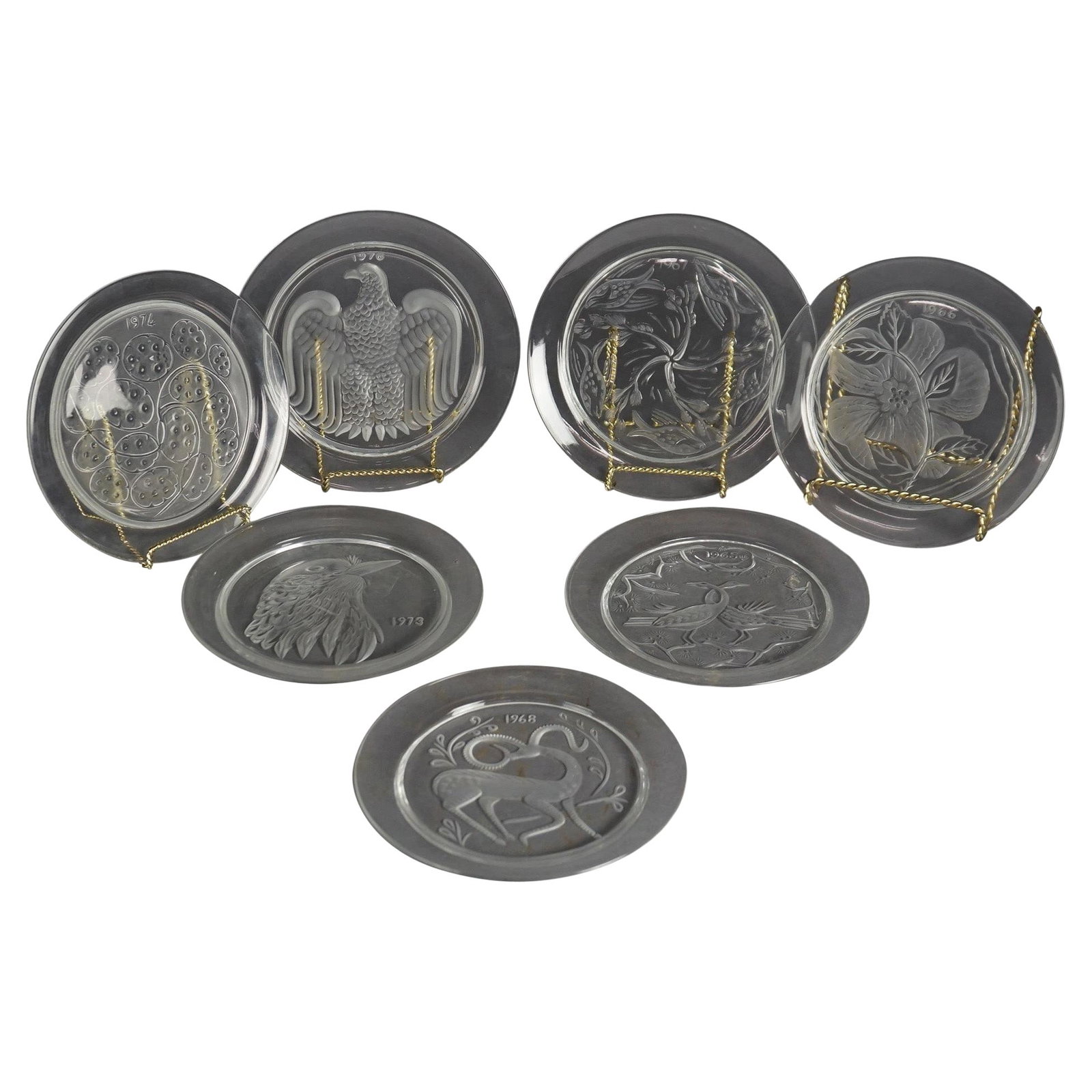Lalique 12-Piece Crystal Plate Set 20th Century Commemorative: Lalique 12-Piece Crystal Plate Set 20th Century Commemorative This stunning twelve-piece French Lalique commemorative crystal plate set hails from the 20th century, specifically crafted between 1965 a
