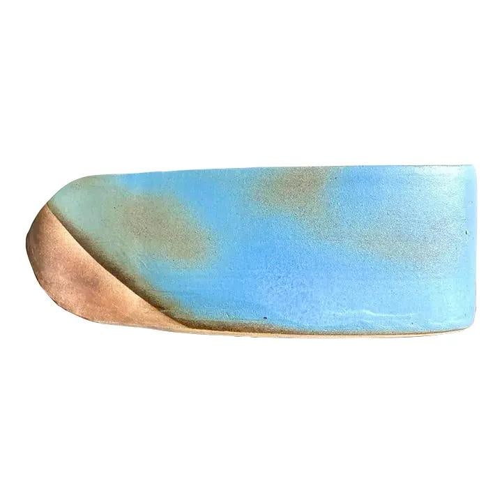 Handmade Vintage Boho Ceramic Vase in Sky Blue Turquoise: Handmade Vintage Boho Ceramic Vase in Sky Blue Turquoise This vintage Boho studio pottery vase showcases a strikingly sculptural design with a bold asymmetric form. Handcrafted from ceramic, it featur