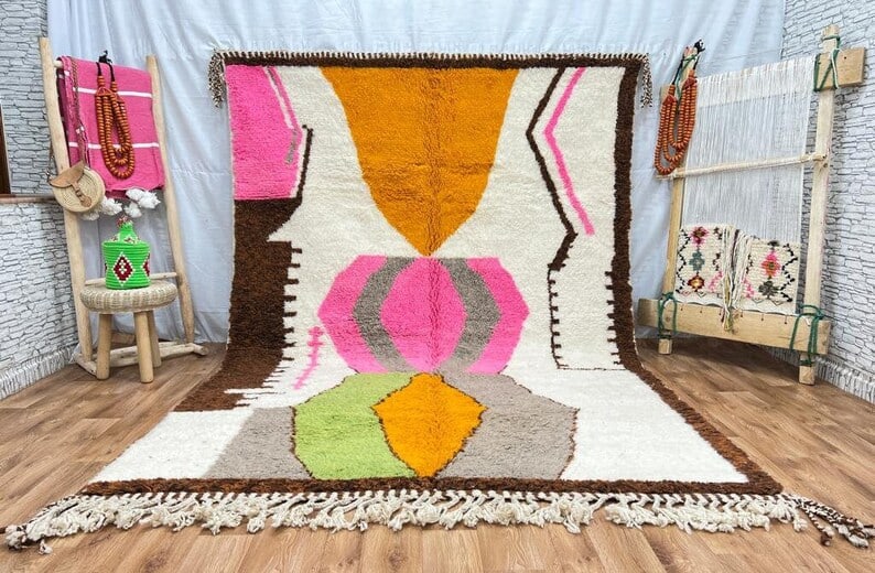 Handmade Colorful Wool Rug 9 x 5 Feet Moroccan Craftsmanship: Handmade Colorful Wool Rug 9 x 5 Feet Moroccan Craftsmanship Discover the charm of this Elegant Colorful Soft Handmade Wool Rug, expertly handwoven in the Atlas Mountains by skilled Berber women weave
