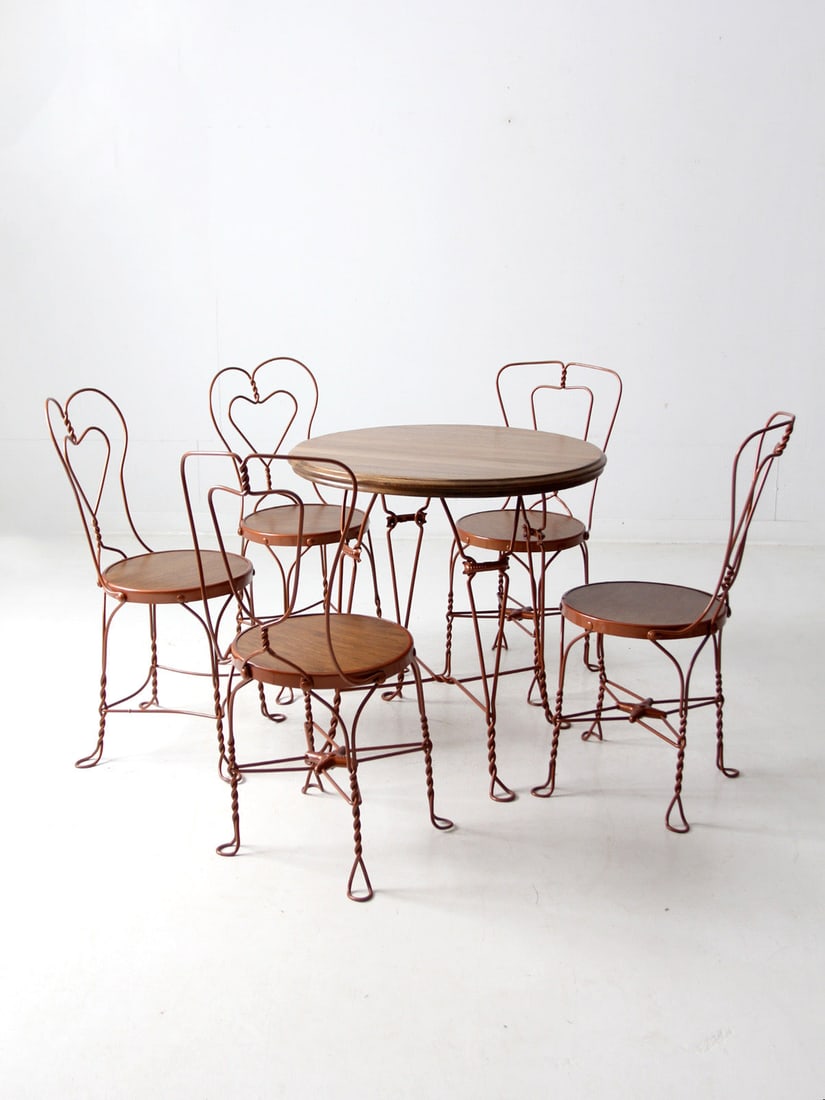 Vintage Bistro Table and 5 Chairs Ice Cream Parlor Set: Vintage Bistro Table and 5 Chairs Ice Cream Parlor Set This charming vintage bistro table and chair set captures the nostalgia of mid-20th century ice cream parlors. It features a wooden tabletop and 
