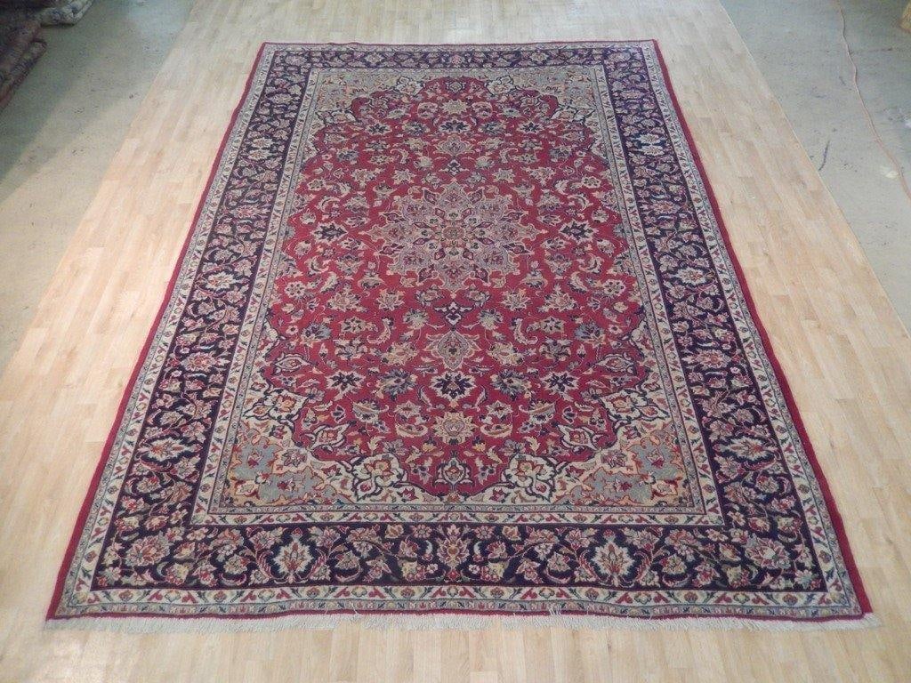 Handcrafted 8'4 x 11'8 Semi-Antique Persian Najaf Isfahan Rug: Handcrafted 8'4 x 11'8 Semi-Antique Persian Najaf Isfahan Rug Free continental US Shipping Experience the elegance of this semi-antique Persian Najaf Isfahan rug, meticulously handcrafted by skilled P