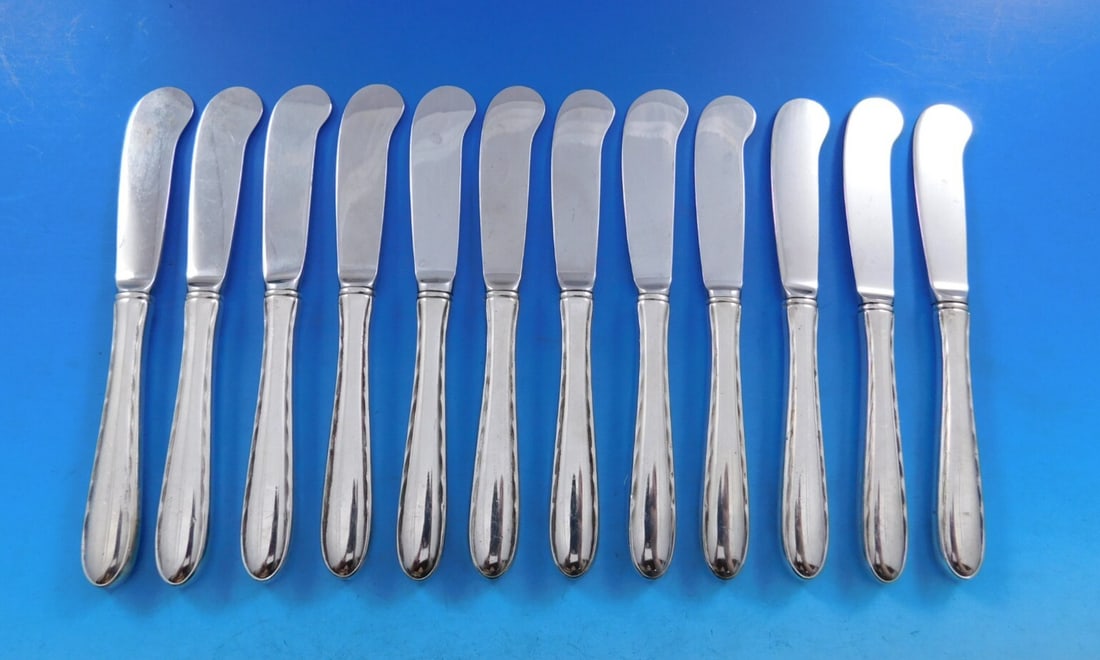 Towle Silver Flutes Sterling Silver Butter Spreader Set of 12: Towle Silver Flutes Sterling Silver Butter Spreader Set of 12 Enhance your dining experience with this exquisite set of 12 butter spreaders from the renowned Silver Flutes pattern by Towle. Crafted fr