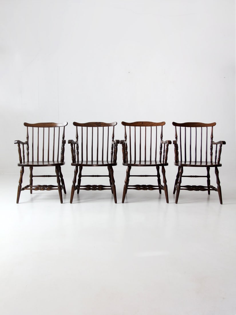 Set of 4 Vintage Windsor Dining Chairs with Spindle Backs: Set of 4 Vintage Windsor Dining Chairs with Spindle Backs This set of four vintage Windsor dining chairs showcases timeless craftsmanship with classic spindle backs and a warm brown finish. The armcha