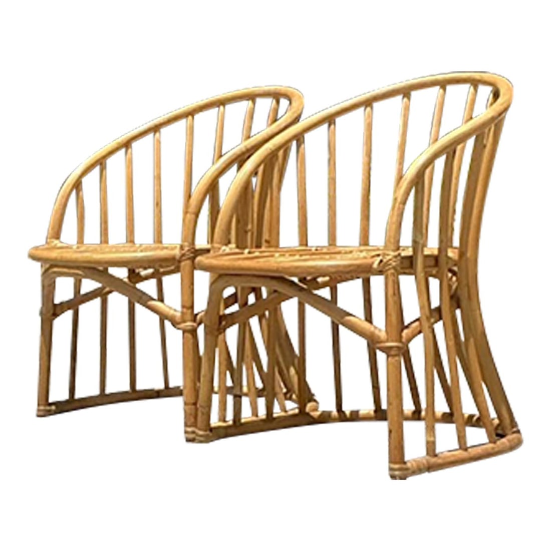 Pair of Vintage Coastal Rattan Lounge Chairs in Khaki: Pair of Vintage Coastal Rattan Lounge Chairs in Khaki Introduce a touch of coastal elegance to your home with this pair of Vintage Coastal Bent Rattan Lounge Chairs. Expertly crafted with a gracefully
