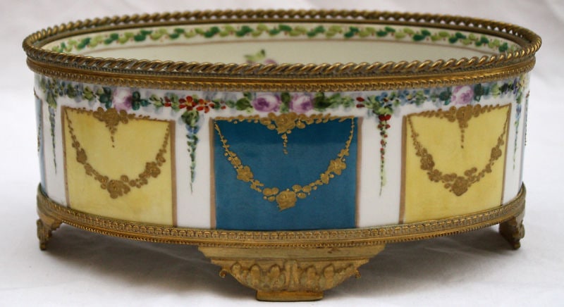 19th Century Sevres Hand Painted Enameled Oval Bowl: 19th Century Sevres Hand Painted Enameled Oval Bowl This exquisite 19th century French Sevres oval center bowl showcases stunning hand-painted enamel work in a captivating blue turquoise hue. Crafted