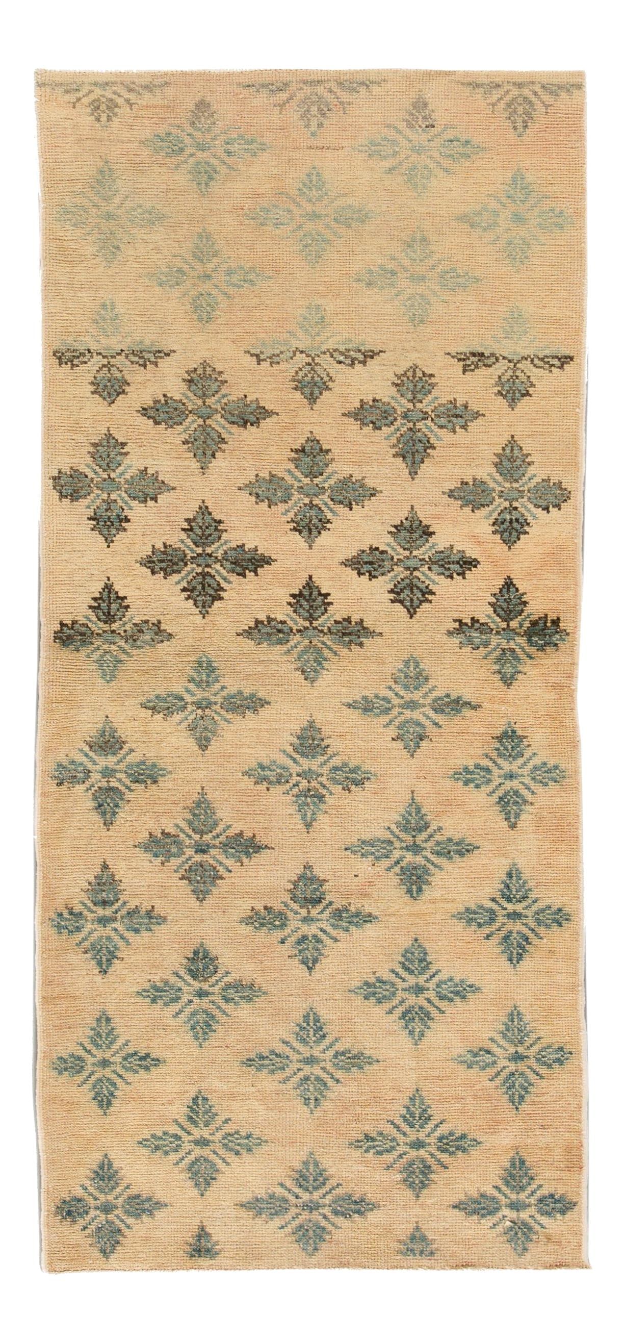 Vintage Khotan Hand-Knotted Wool Rug 6'2" x 2'9" Floral Design: Vintage Khotan Hand-Knotted Wool Rug 6'2" x 2'9" Floral Design Enhance your home decor with this exquisite hand-knotted vintage Khotan rug, showcasing a captivating all-over floral design. The intrica