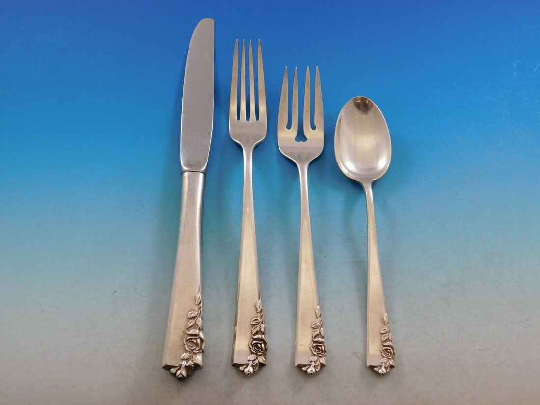 Garnet Rose Lunt Sterling Silver 4-Piece Flatware Set: Garnet Rose Lunt Sterling Silver 4-Piece Flatware Set This exquisite 4-piece place setting from the Garnet Rose pattern by Lunt is crafted from high-quality sterling silver. The set includes a regular