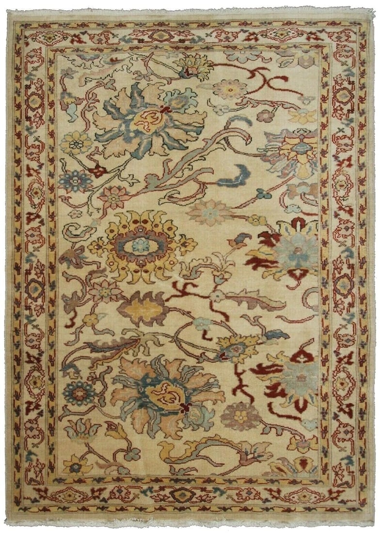 Handwoven Ivory Wool 4x6 ft Floral Area Rug: Handwoven Ivory Wool 4x6 ft Floral Area Rug This rare vintage handmade area rug features a traditional floral and geometric pattern in soft ivory tones, accented with red, light blue, sage green, and 
