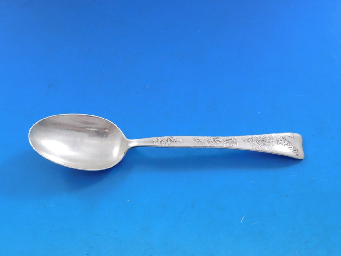 Tiffany Sterling Silver Teaspoon Lap Over Edge Lily of the Valley 6": Tiffany Sterling Silver Teaspoon Lap Over Edge Lily of the Valley 6" This exquisite teaspoon, crafted by Tiffany & Co., features the elegant Lap Over Edge pattern and is adorned with a beautiful lily 