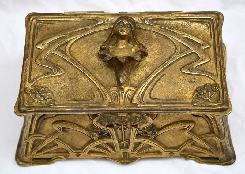 19th Century Art Nouveau French Bronze Box by Cuenardeau: 19th Century Art Nouveau French Bronze Box by Cuenardeau This exquisite 19th century Art Nouveau box is a remarkable piece of French craftsmanship, made from bronze and metal. It features intricate de