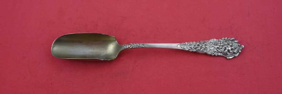Reed & Barton Trajan Sterling Silver Cheese Scoop 7 3/4": Reed & Barton Trajan Sterling Silver Cheese Scoop 7 3/4" This exquisite cheese scoop from the Trajan pattern by Reed and Barton is crafted from high-quality sterling silver, featuring a long design th