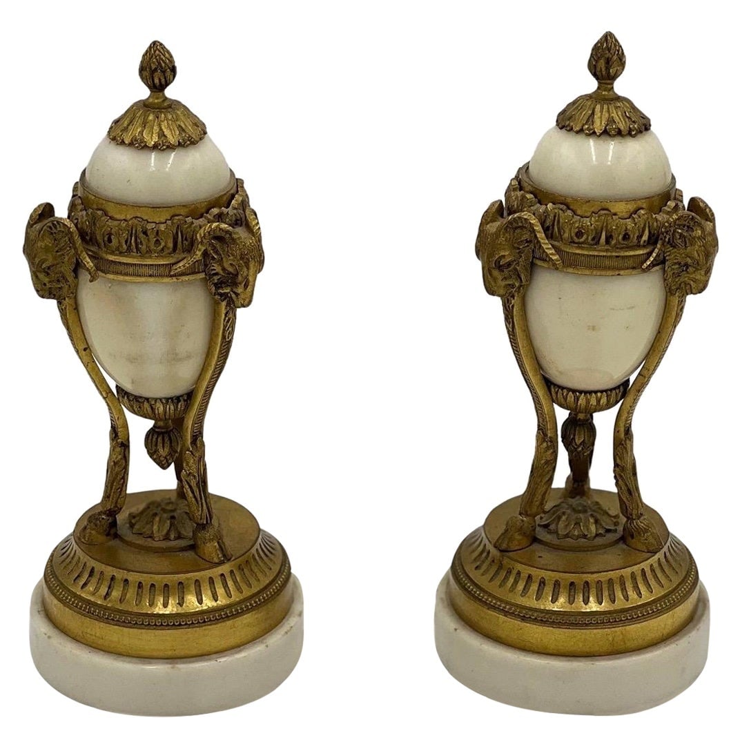 Set of 2 Louis XVI Style Gilt Bronze Marble Rams Head Cassolettes: Set of 2 Louis XVI Style Gilt Bronze Marble Rams Head Cassolettes This exquisite pair of 19th-century Louis XVI style cassolettes showcases the elegance and craftsmanship of the era. Made from gilt br