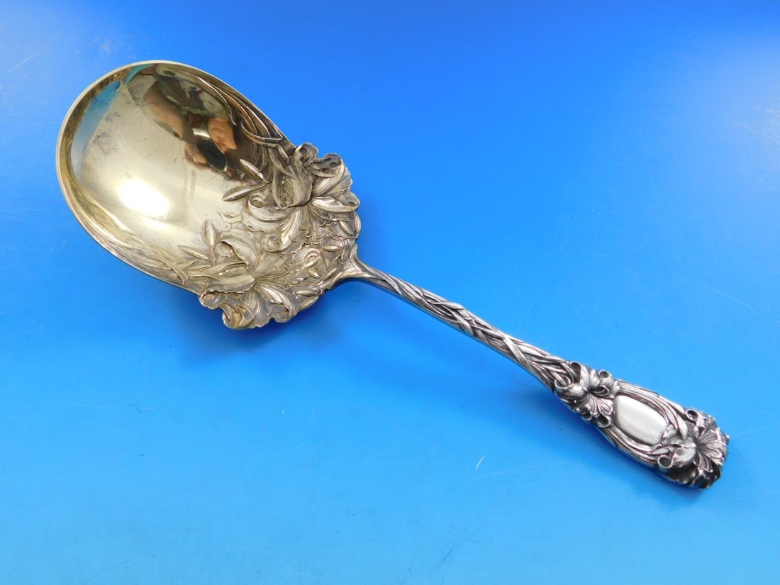 Durgin New Art Sterling Silver Berry Spoon Gold Washed Lilies 8 3/4": Durgin New Art Sterling Silver Berry Spoon Gold Washed Lilies 8 3/4" This exquisite serving spoon from Durgin features a stunning Art Nouveau design known as "New Art". Crafted from sterling silver wi