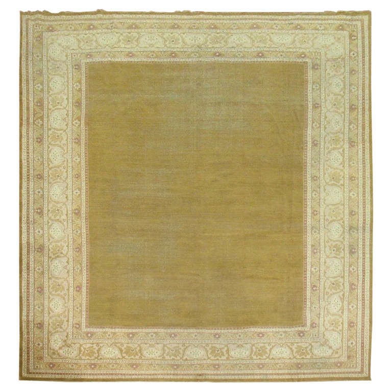 19th Century Green Antique Indian Amritsar Rug 10'1 x 13'3: 19th Century Green Antique Indian Amritsar Rug 10'1 x 13'3 Experience the timeless elegance of this 19th-century Indian Amritsar rug from the Zabihi Collection. This exquisite piece features a minimal