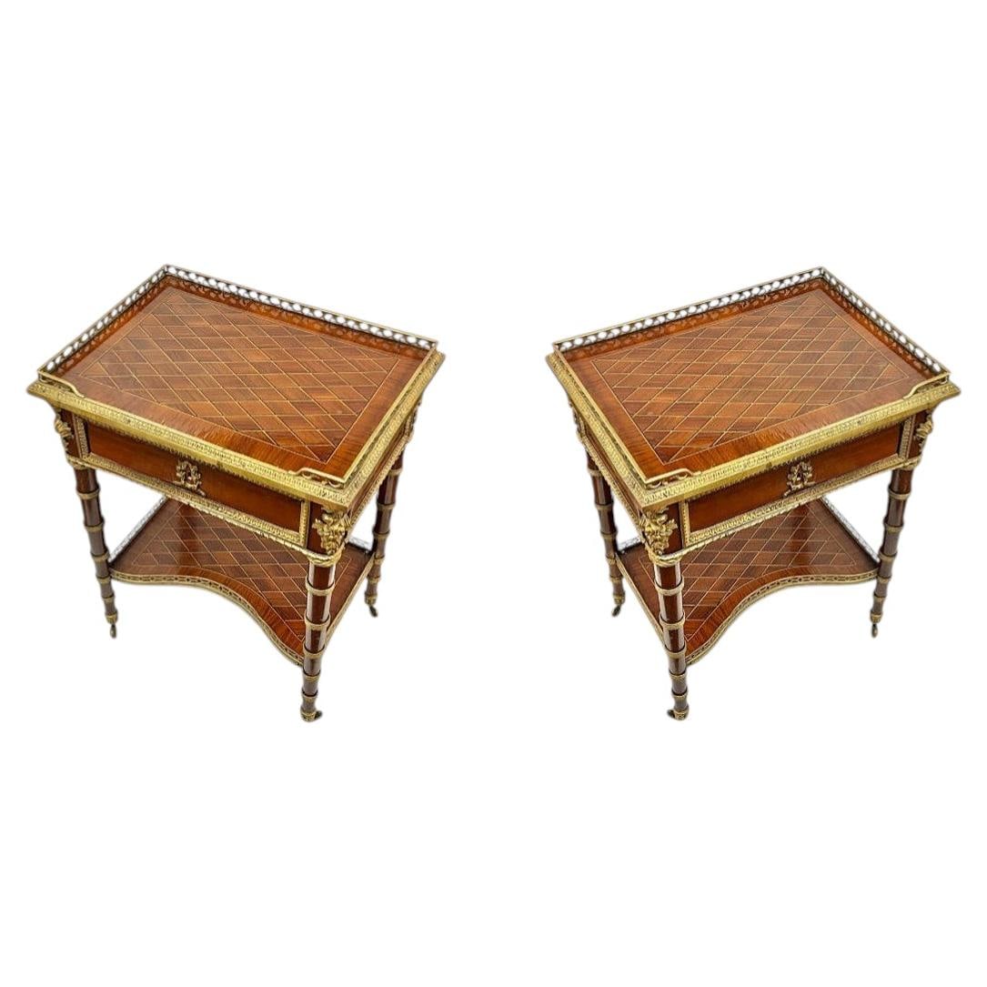 French Louis XVI bronze mounted inlaid side tables set of 2: French Louis XVI bronze mounted inlaid side tables set of 2 This set of two French Louis XVI style side tables features intricate marquetry inlay and elegant bronze mounts. Crafted from wood and adorn