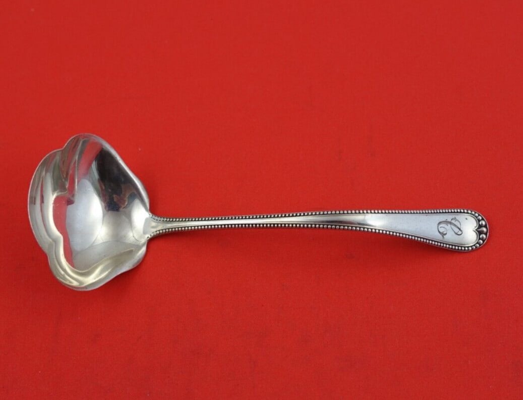 Gorham Newcastle Sterling Silver Sauce Ladle 5 1/4 Inch Monogrammed: Gorham Newcastle Sterling Silver Sauce Ladle 5 1/4 Inch Monogrammed This exquisite sauce ladle is part of the Newcastle pattern by Gorham, crafted from high-quality sterling silver. Measuring 5 1/4 in
