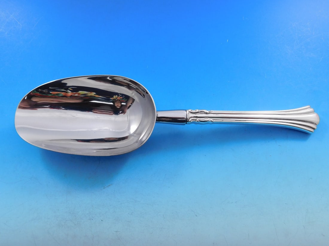 Reed & Barton Eighteenth Century Sterling Silver Ice Scoop 10": Reed & Barton Eighteenth Century Sterling Silver Ice Scoop 10" This exquisite ice scoop features a classic Eighteenth Century pattern by Reed & Barton, crafted from high-quality sterling silver. Desig