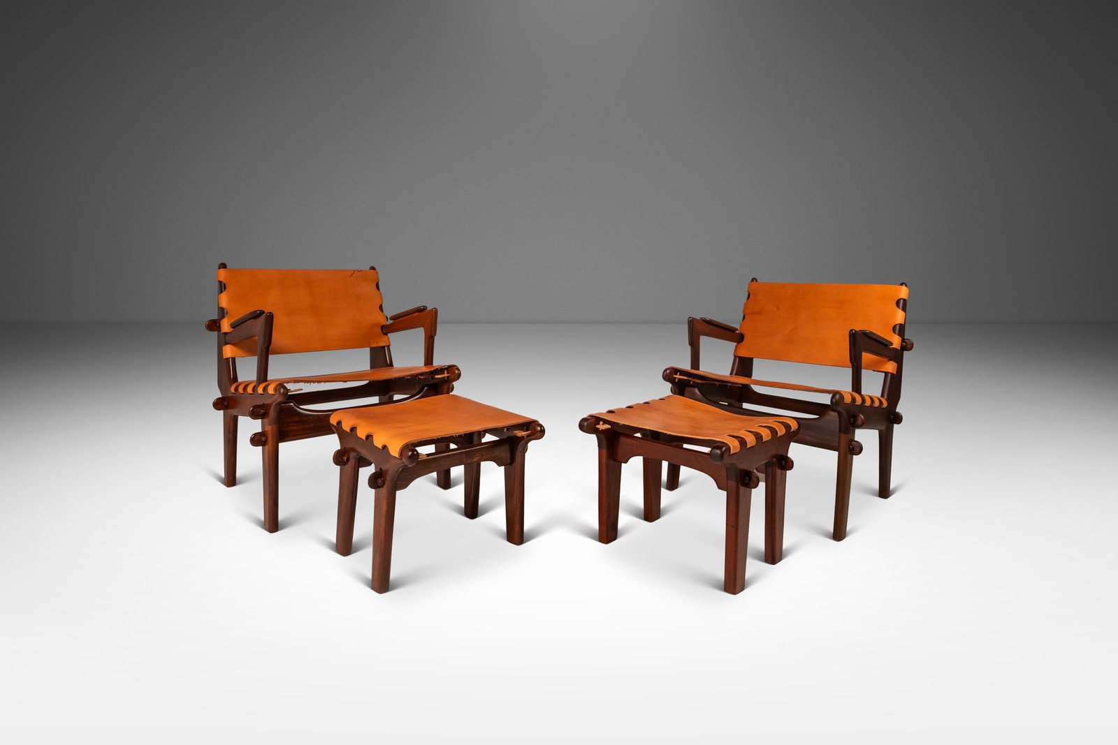 Angel Pazmino Set of 2 Mid-Century Modern Leather Sling Chairs with Ottomans: Angel Pazmino Set of 2 Mid-Century Modern Leather Sling Chairs with Ottomans This stunning set of two Mid-Century Modern sling chairs with ottomans, designed by acclaimed Ecuadorian furniture maker An
