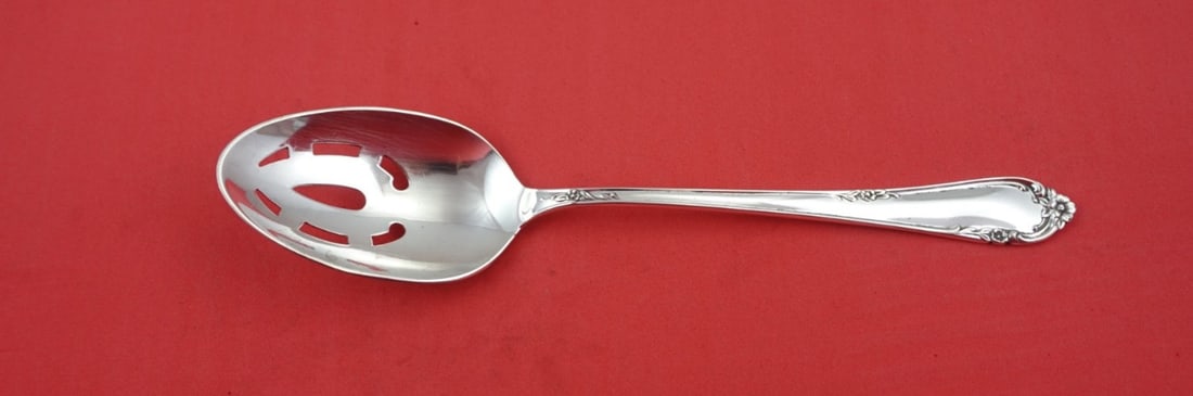 Reed and Barton Dancing Flowers Sterling Silver Pierced Spoon 8 5/8": Reed and Barton Dancing Flowers Sterling Silver Pierced Spoon 8 5/8" This exquisite serving spoon features the elegant Dancing Flowers pattern by Reed and Barton. Crafted from high-quality sterling si