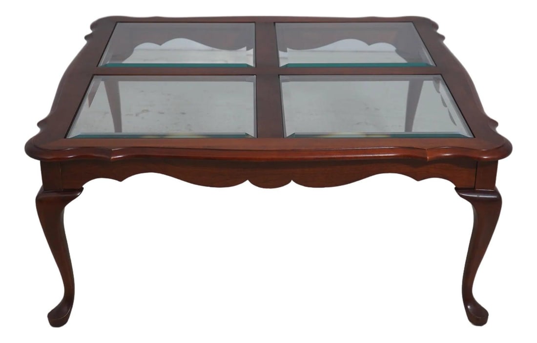 Square Cherry Wood Coffee Table with Beveled Glass Top and Queen Anne Legs: Square Cherry Wood Coffee Table with Beveled Glass Top and Queen Anne Legs This traditional coffee table features a solid cherry wood frame with a beveled glass top, showcasing quality construction an