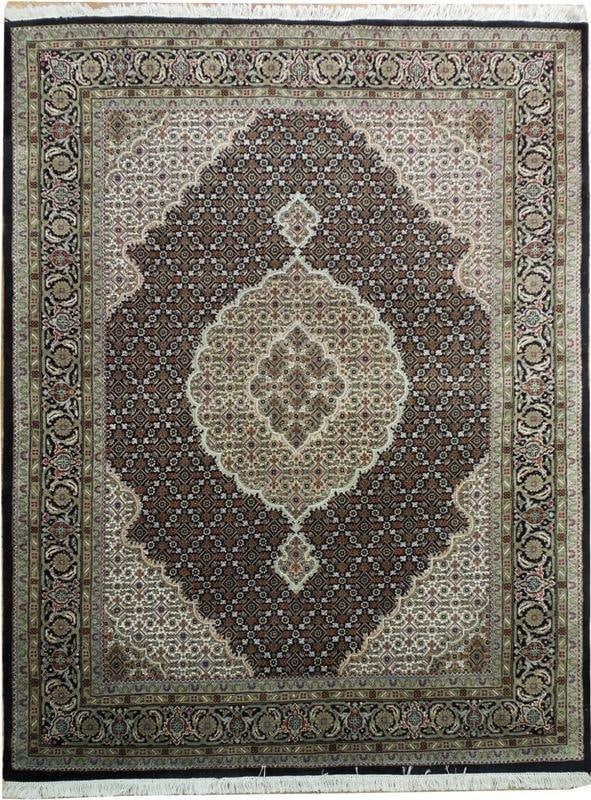 5' x 6' 5" Black Tabriz Mahi Hand-Knotted Wool Silk Rug: 5' x 6' 5" Black Tabriz Mahi Hand-Knotted Wool Silk Rug Free continental US Shipping Handmade Tabriz Mahi rug in a black colorway with an intricate traditional fish motif. It is crafted from a wool an