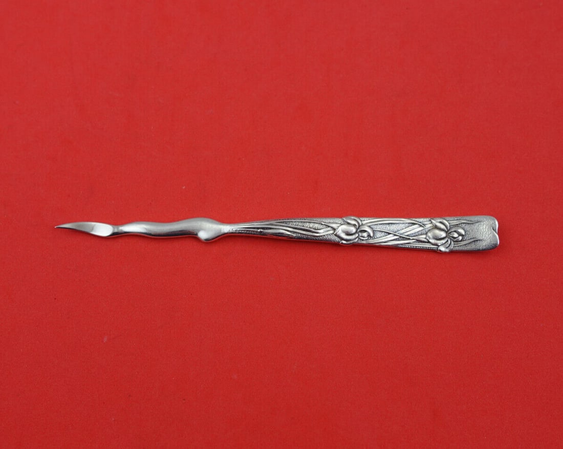 Tiffany & Co. Vine Sterling Silver Nut Pick 5" Iris Motif: Tiffany & Co. Vine Sterling Silver Nut Pick 5" Iris Motif This exquisite nut pick from the renowned Vine pattern by Tiffany & Co. showcases a stunning iris motif handle. Crafted from sterling silver, 