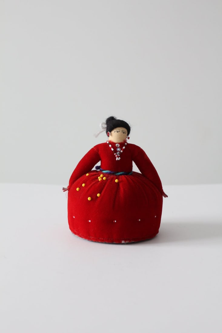 Vintage Native American Doll Pin Cushion Red Velvet 4.5 Inch: Vintage Native American Doll Pin Cushion Red Velvet 4.5 Inch Discover this charming vintage Native American doll pin cushion, designed with a vibrant red velvet dress adorned with a beaded necklace an