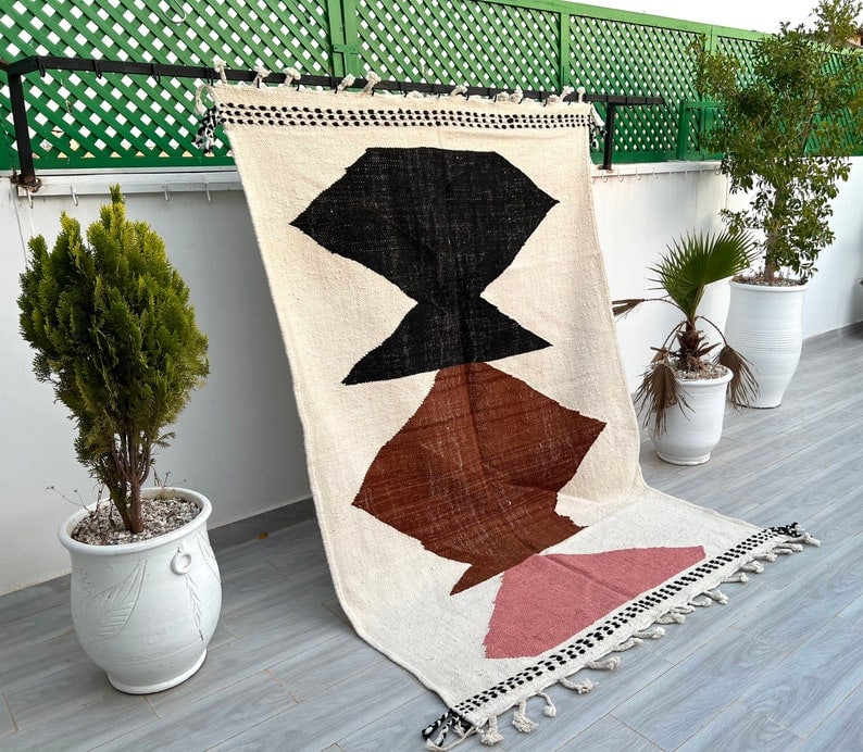 Handmade Moroccan Berber Wool Rug 9.84 x 6.56 Feet: Handmade Moroccan Berber Wool Rug 9.84 x 6.56 Feet This beautiful, authentic handmade Moroccan Berber wool area rug showcases the skill of local Berber women weavers from the Atlas Mountains. Crafted 