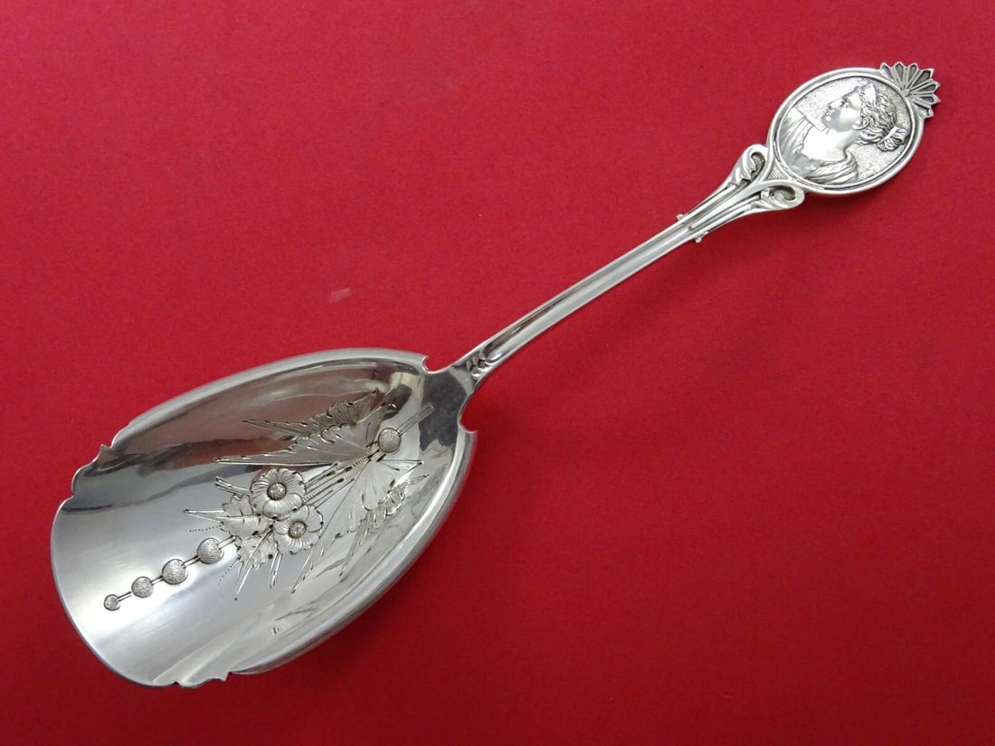 Wood & Hughes Medallion Diana Coin Silver Berry Scoop 9": Wood & Hughes Medallion Diana Coin Silver Berry Scoop 9" Introducing a stunning serving spoon from the renowned Wood & Hughes, known as Medallion (also referred to as Diana). This exquisite coin silve