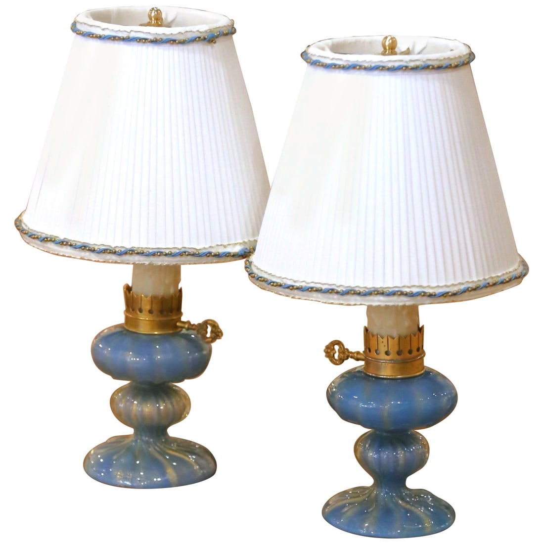 Set of 2 Italian Murano blue art glass table lamps with custom shades: Set of 2 Italian Murano blue art glass table lamps with custom shades Pair of Mid-Century Italian Murano blue art glass table lamps sold as a set of 2. Each lamp features a hand-blown ribbed glass bod